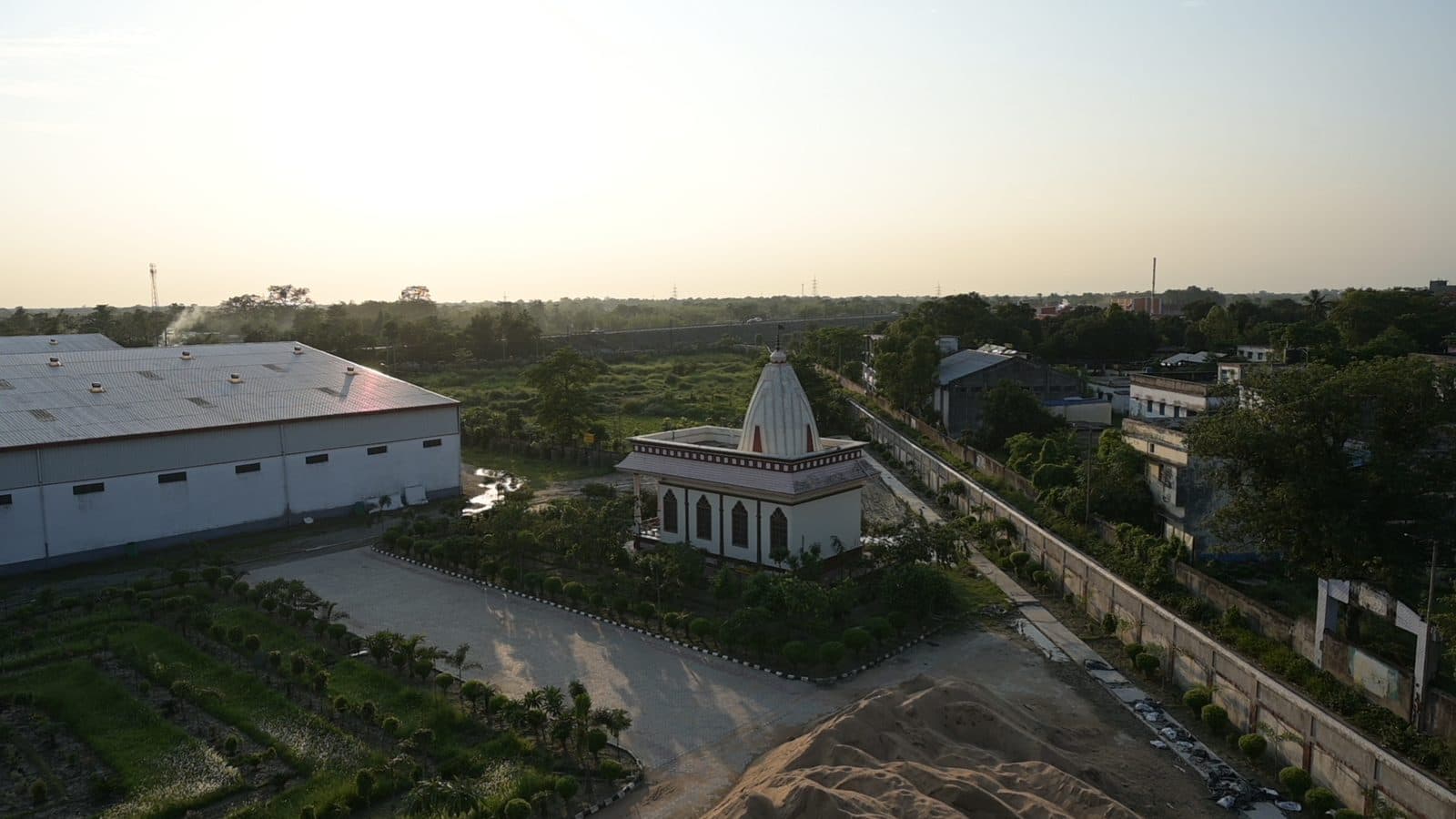 On-site temple and warehousing across the green campus